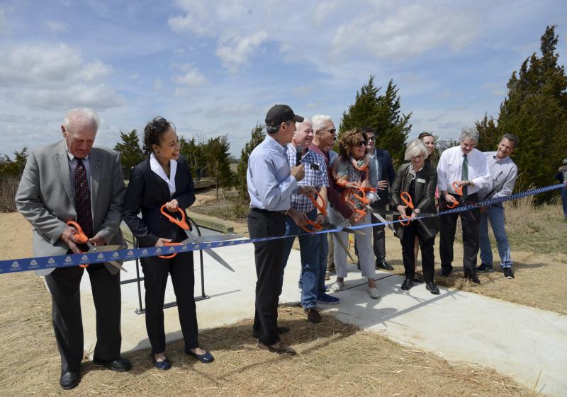 Cutting the ribbon are (l-r) Sen. Dave Wilson, Sen. Lisa Blunt Rochester, Gov. John Carney, Randy Marvel, Harvey Marvel, Kate Marvel, Anne Harper, Nicol Majewski, Sen, Shawn Garvin and Slaughter Mayor Harry Ward